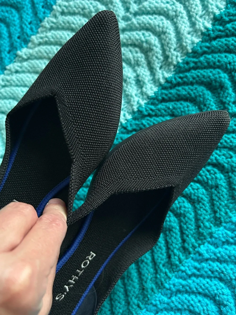 Rothy's Black Pointed Flats with Blue Trim